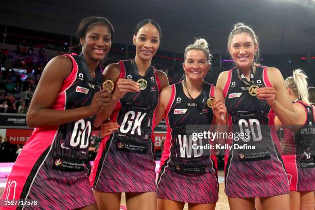 Latanya Wilson, Shamera Sterling, Maisie Nankivell and Matilda Garrett of the Thunderbirds celebrate victory during the 2023 Super Netball Grand...