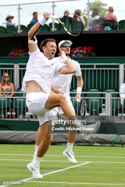 Michael Venus of New Zealand plays a smash with partner Jamie Murray of Great Britain against Alexander Erler of Austria and Lucas Miedler of Austria...