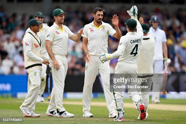 Mitchell Starc of Australia celebrates dismissing Moeen Ali of England during Day Four of the LV= Insurance Ashes 3rd Test Match between England and...
