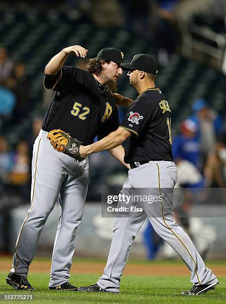 Joel Hanrahan of the Pittsburgh Pirates celebrates the win over the New York Mets with teammate Gaby Sanchez after the game on September 25, 2012 at...