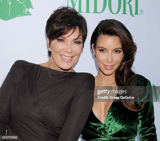 Actors/TV personalities Kris Jenner and Kim Kardashian arrive at the Midori Makeover Parlour event at Fred Segal on September 25, 2012 in Santa...