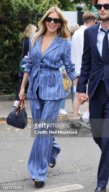 Sienna Miller attends day seven of the Wimbledon Tennis Championships at All England Lawn Tennis and Croquet Club at All England Lawn Tennis and...