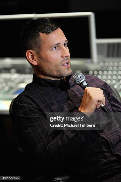 Producer Kaskade gets interviewed at an "Up Close & Personal with Steve Aoki and Kaskade" Q&A session for GRAMMY U Los Angeles at Los Angeles Film...