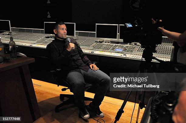 Producer Kaskade gets interviewed at an "Up Close & Personal with Steve Aoki and Kaskade" Q&A session for GRAMMY U Los Angeles at Los Angeles Film...