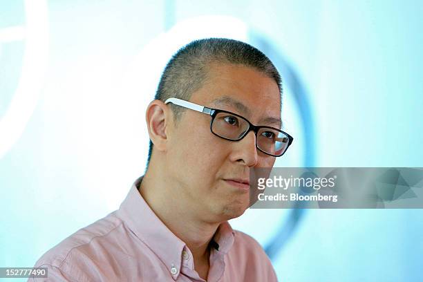 Victor Koo, chairman and chief executive officer of Youku Tudou Inc., listens during an interview in Beijing, China, on Wednesday, Sept. 26, 2012....