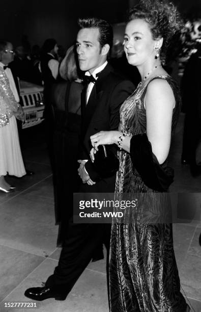 Luke Perry and Rachel Sharp attend an event at the Beverly Hilton Hotel in Beverly Hills, California, on October 2, 1992.