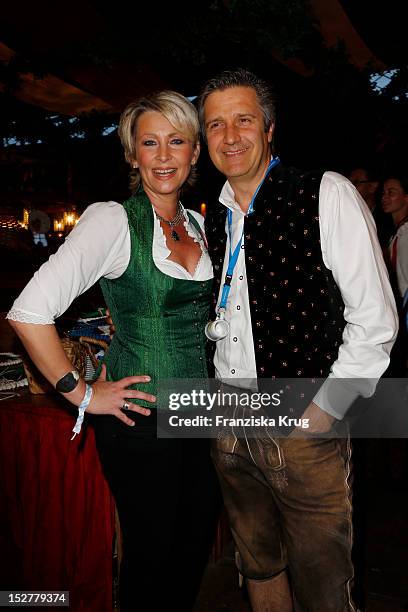 Claudia Jung and Hans Singer attend the 'Goldstar TV Wiesn' as part of the Oktoberfest beer festival at Weinzelt on September 25, 2012 in Munich,...