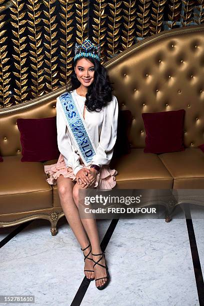 Chinese Miss World 2012 Wenxia Yu poses at the hotel Fouquet's on September 26, 2012 in Paris. AFP PHOTO / FRED DUFOUR