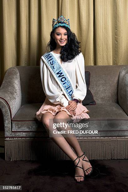 Chinese Miss World 2012 Wenxia Yu poses at the hotel Fouquet's on September 26, 2012 in Paris. AFP PHOTO / FRED DUFOUR