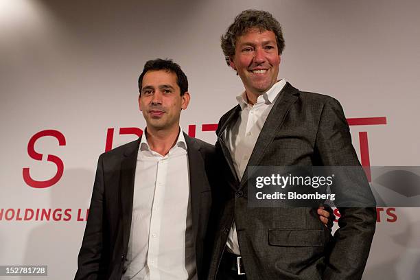 Jose Manuel Martinez Gutierrez, incoming chief executive officer of Esprit Holdings Ltd., left, poses with Ronald Van Der Vis, outgoing chief...