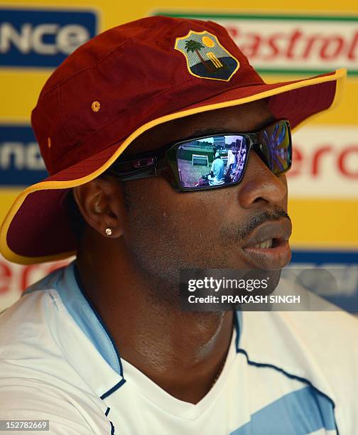 West Indies cricketer Kieron Pollard rests during an ICC Twenty20 Cricket World Cup practice session at the Pallekele International Cricket Stadium...