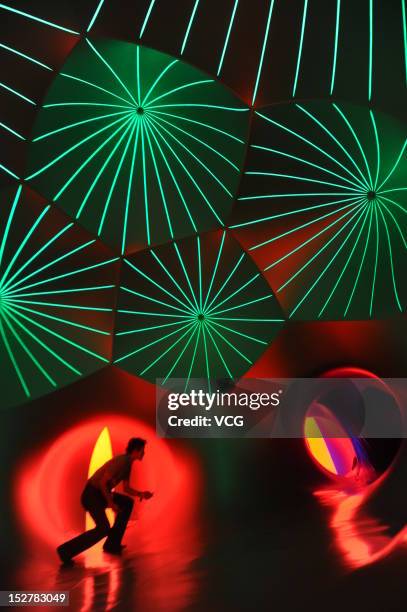 People walk inside the Miracoco Luminarium, an inflatable sculpture by British artist Alan Parkinson of Architects of Light, at Evergreen Garden...