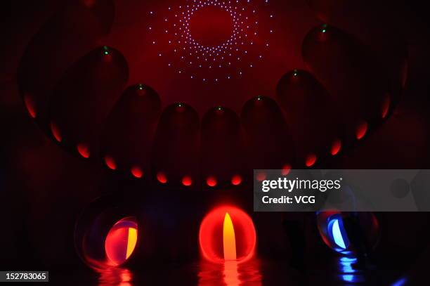 People walk inside the Miracoco Luminarium, an inflatable sculpture by British artist Alan Parkinson of Architects of Light, at Evergreen Garden...