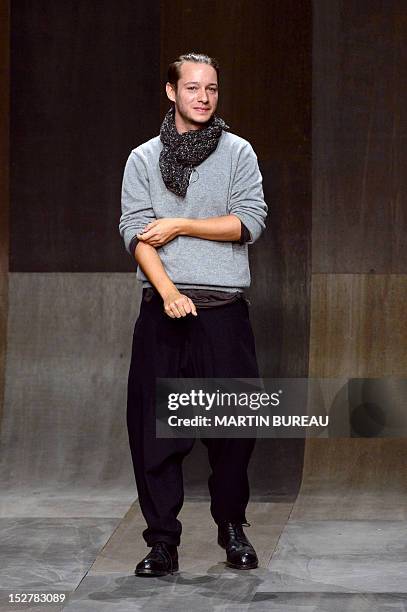 Croatian fashion designer Damir Doma acknowledges the public following his Spring/Summer 2013 ready-to-wear collection show on September 26, 2012 in...