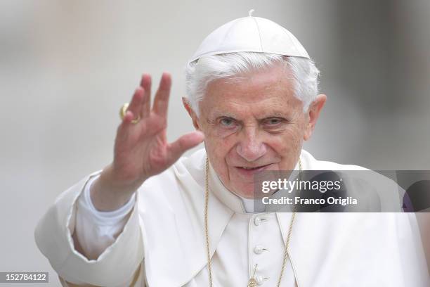 Pope Benedict XVI waves to the faithful gathered in St. Peter's Square during his weekly audience on September 26, 2012 in Vatican City, Vatican. The...