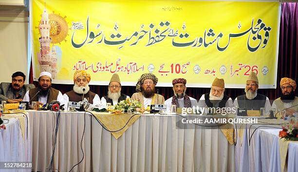 Hafiz Mohammad Saeed , head of Pakistan's hard line Islamic group of Jamaat ud Dawa , addresses a conference for the "safeguarding the honour of the...