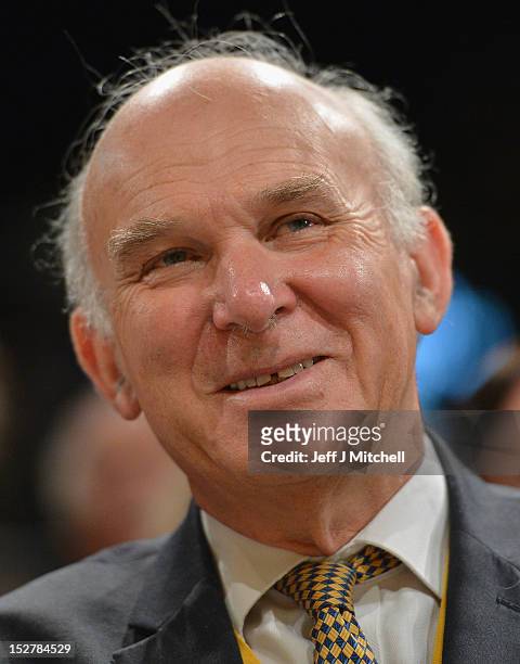 Business Secretary Vince Cable looks on as Jo Swinson, Secretary of State for Employment, addresses the Liberal Democrat party Conference on...