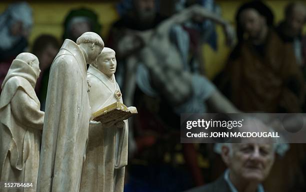 Some of the 37 alabaster statues depicting mourners are displayed as part of the exhibition "Lamentations for a Dead Prince - The Pleurants from the...