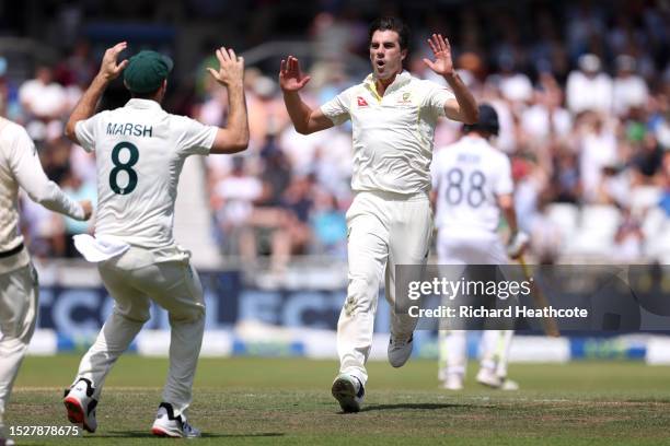 Australia captain Pat Cummins celebrates with Mitchell Marsh after dismissing Joe Root of England during Day Four of the LV= Insurance Ashes 3rd Test...