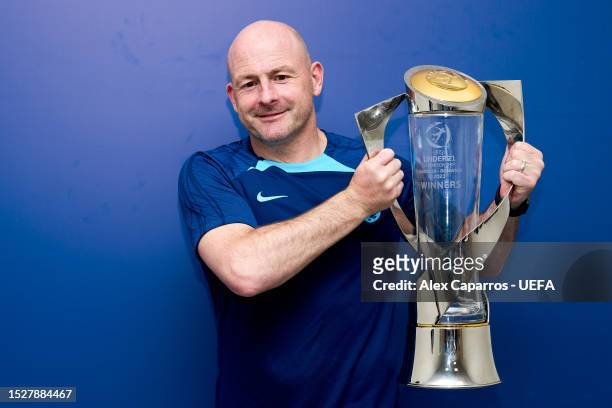 Lee Carsley, Head Coach of England poses for a photograph with the UEFA Under-21 Euro 2023 trophy after defeating Spain during the UEFA Under-21 Euro...