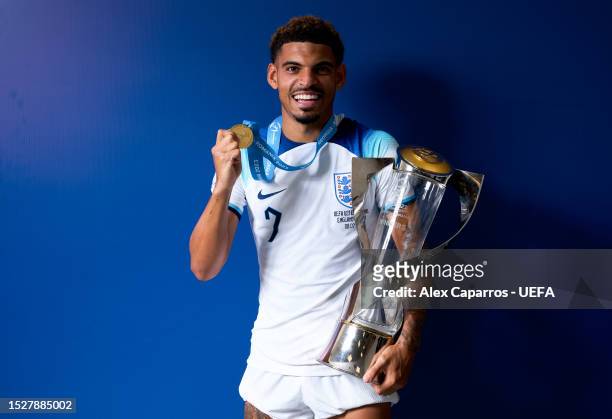 Morgan Gibbs White of England poses for a photograph with the UEFA Under-21 Euro 2023 trophy after defeating Spain during the UEFA Under-21 Euro 2023...