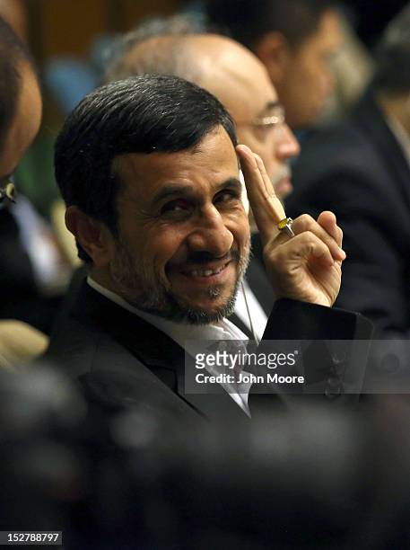 Mahmoud Ahmadinejad, President of the Islamic Republic of Iran, sits with his delegation before addressing the UN General Assembly on September 26,...