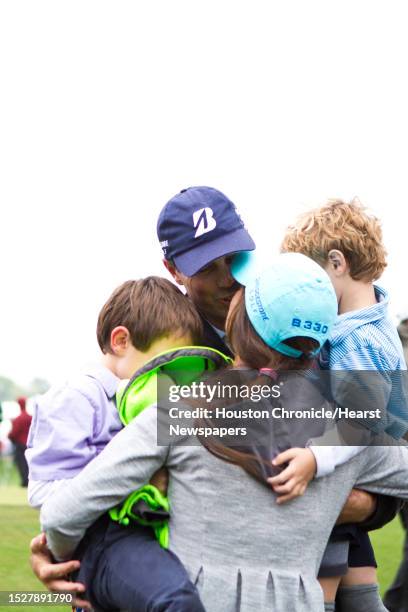 Matt Kuchar shares a moment with his wife Sybi Kuchar and their sons Cameron Kuchar, left and Carson Kuchar after winning winning second place during...