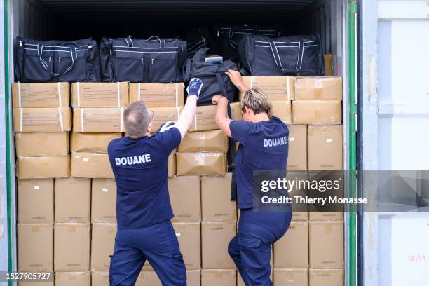 Custom officers are looking for drugs in a container on July 11, 2023 in the Port of Antwerp, Kallo, Beveeren, Belgium. Drugs, in particular cocaine...