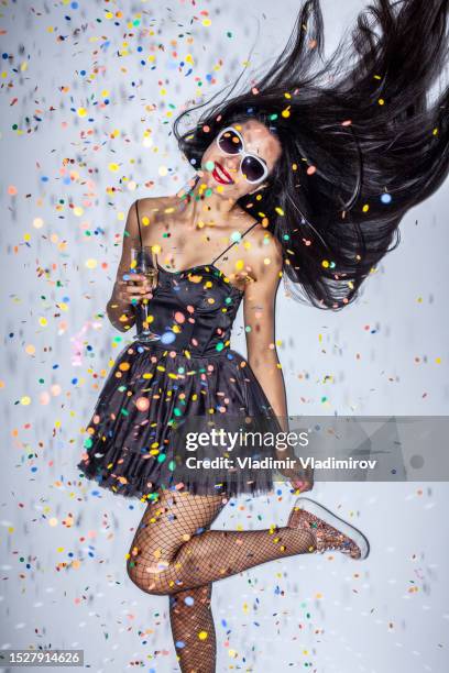 woman dancing in a cloud of glitter - models in stockings stock pictures, royalty-free photos & images