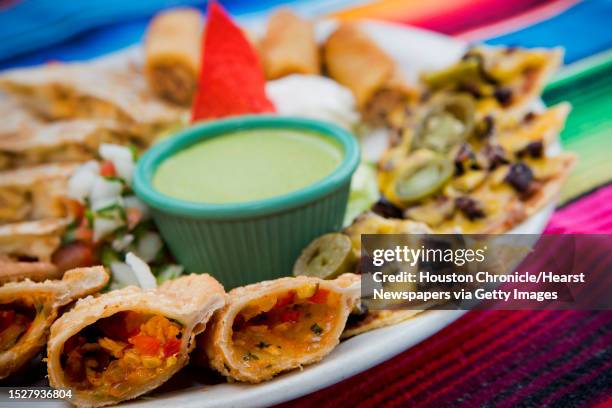 El Patio Mexican Restaurant's El Patio Sampler consists of four chicken quesadillas, four beef fajita nachos, two chicken flautas and two chicken...
