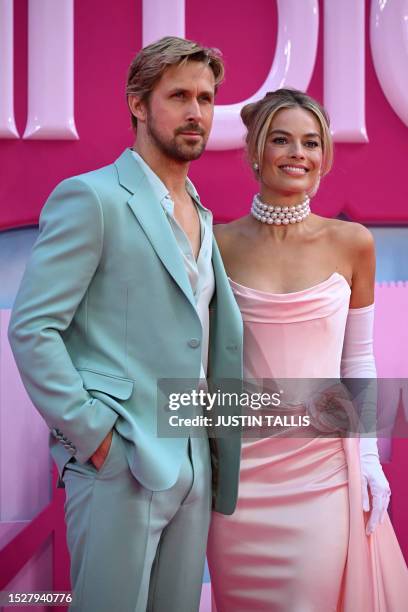 Canadian actor Ryan Gosling and Australian actress Margot Robbie pose on the pink carpet upon arrival for the European premiere of "Barbie" in...