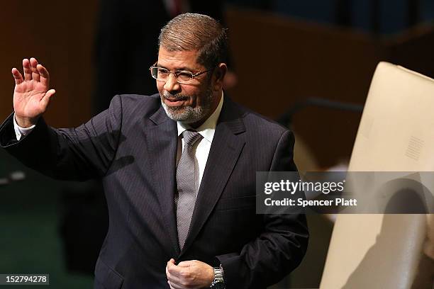 Egyptian President Mohammed Morsi walks to the podium for his address to world leaders at the United Nations General Assembly on September 26, 2012...