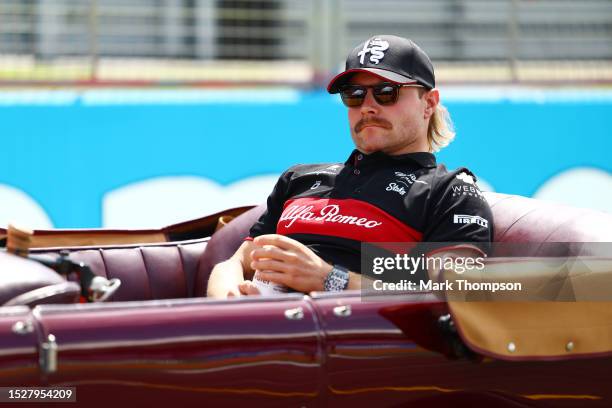 Valtteri Bottas of Finland and Alfa Romeo F1 looks on from the drivers parade prior to the F1 Grand Prix of Great Britain at Silverstone Circuit on...