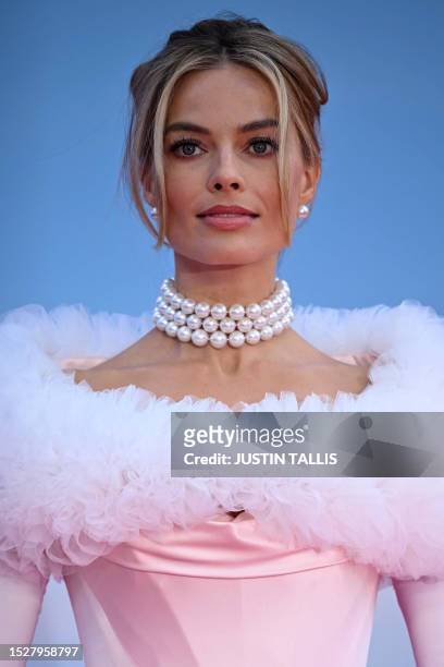 Australian actress Margot Robbie poses on the pink carpet upon arrival for the European premiere of "Barbie" in central London on July 12, 2023.
