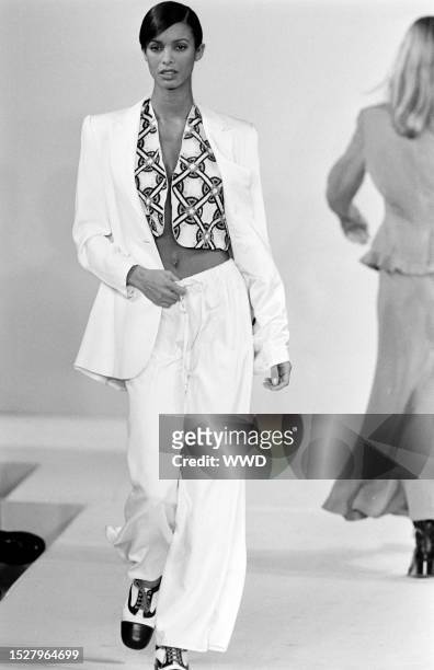 Model Maureen Gallagher walks the runway in the Tracy Reese for Magaschoni Spring 1994 Ready to Wear Runway Show on November 4 in New York City....