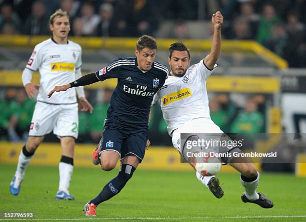 Martin Stranzl of Moenchengladbach challenges Ivo Ilicevic of Hamburg during the Bundesliga match between Borussia Moenchengladbach and Hamburger SV...