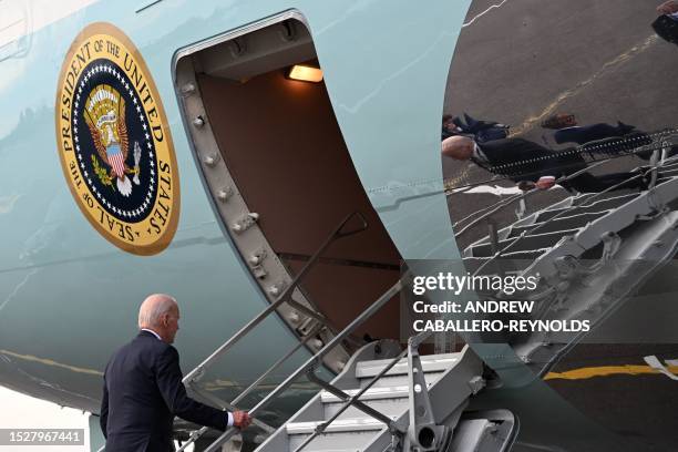 President Joe Biden boards Air Force One as he departs from the Vilnius International Airport in Vilnius, Lithuania, on July 12 after the end of NATO...
