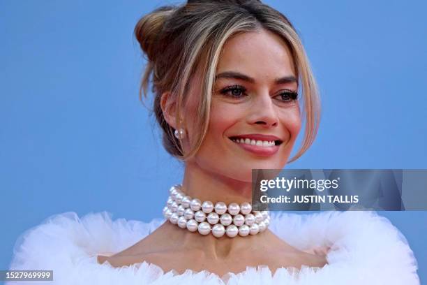 Australian actress Margot Robbie poses on the pink carpet upon arrival for the European premiere of "Barbie" in central London on July 12, 2023.