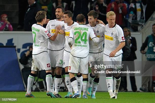 Martin Stranzl of Moenchengladbach celebrates with teammates after scoring his team's first goal during the Bundesliga match between Borussia...