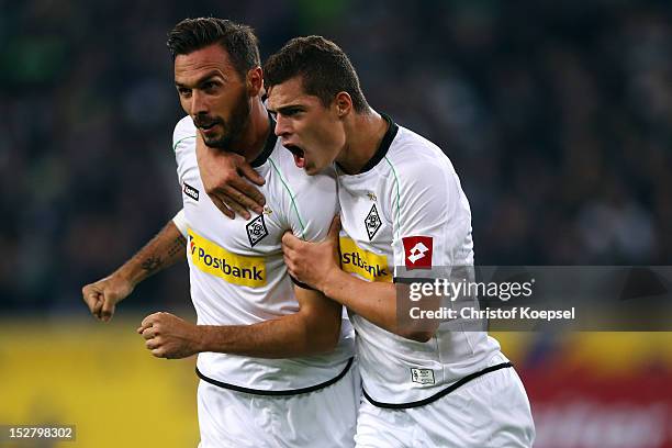 Martin Stranzl celebrates the first goal with Granit Xhaka of Moenchengladbach during the Bundesliga match between Borussia Moenchengladbach and...