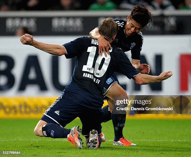 Artjoms Rudnevs of Hamburg celebrates with teammate Heung Min Son after scoring his team's second goal during the Bundesliga match between Borussia...