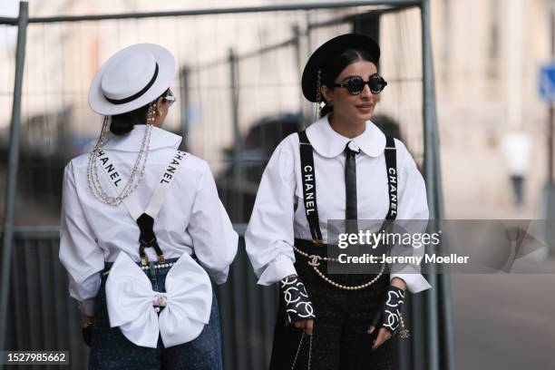 Snehal and Jyoti Babani seen outside Chanel show wearing round logo Chanel sunnies, Chanel logo strap ons, white Chanel blouses, Chanel pearl belts,...