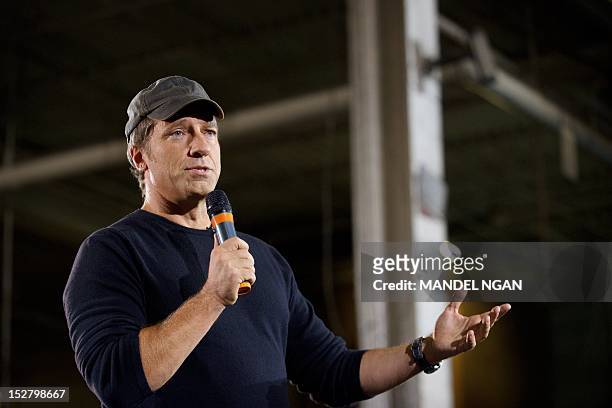 Personality Mike Rowe , host of "Dirty Jobs", takes part in a roundtable discussion on manufacturing with Republican presidential candidate Mitt...