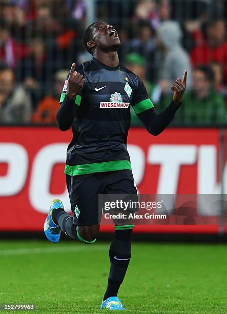Joseph Akpala of Bremen celebrates his team's first goal during the Bundesliga match between SC Freiburg and SV Werder Bremen at MAGE SOLAR Stadium...