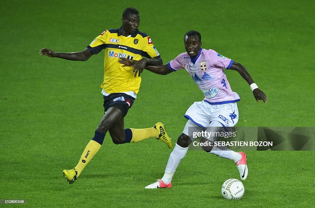 Mohammed Rabiu Evian's Ghanaian midfielder Mohammed Rabiu vies with Sochaux'... News ...
