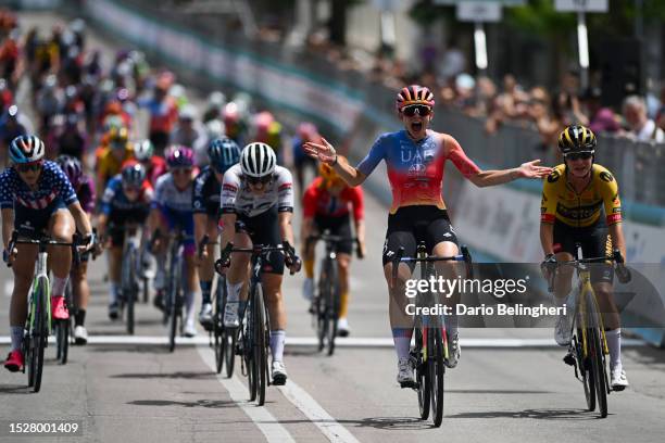 Chiara Consonni of Italy and UAE Team ADQ celebrates at finish line as stage winner ahead of Ally Wollaston of New Zealand and Team AG Insurance -...