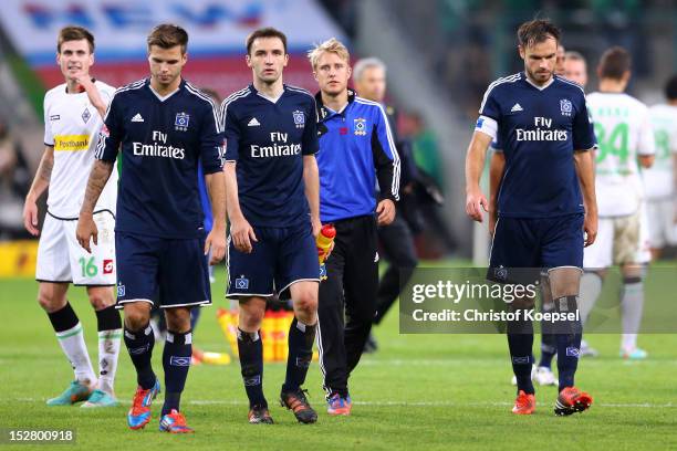 Dennis Diekmeier, Milan Bedelj, Per Ciljan Skjelbred and Heiko Westermann of Hamburg look dejected after the 2-2 draw of the Bundesliga match between...