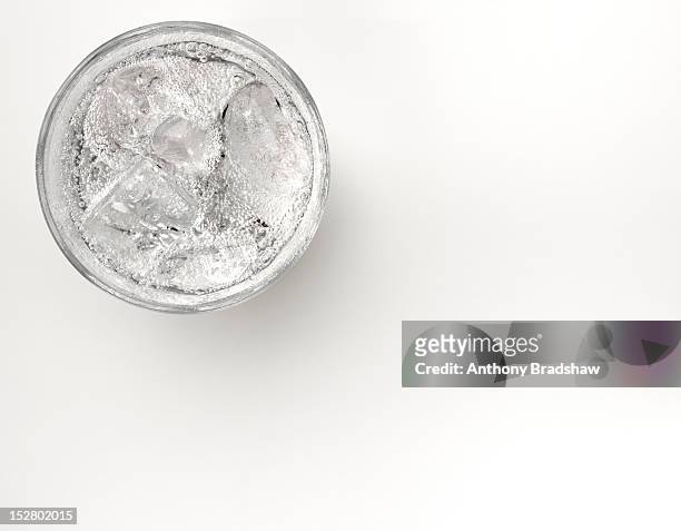 a glass of sparkling water with ice - carbonated water imagens e fotografias de stock
