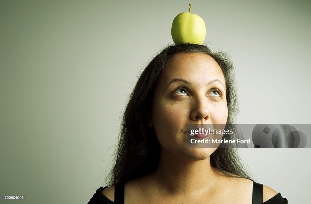 Woman with apple on head