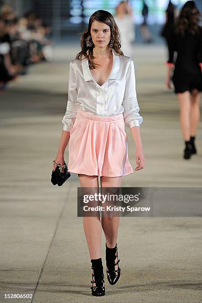 Model walks the runway during the Alexis Mabille Spring / Summer 2013 show as part of Paris Fashion Week at Docks en Seine on September 26, 2012 in...